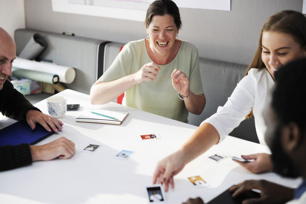 Smiling workers answering what is coworking?